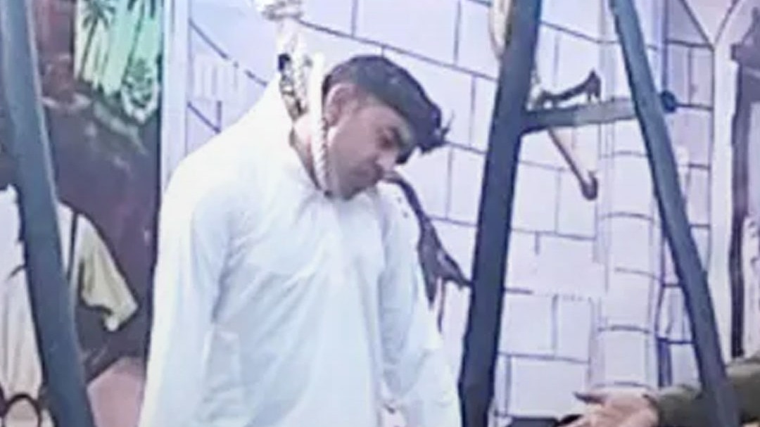 alive man hanged on a noose in tableau 