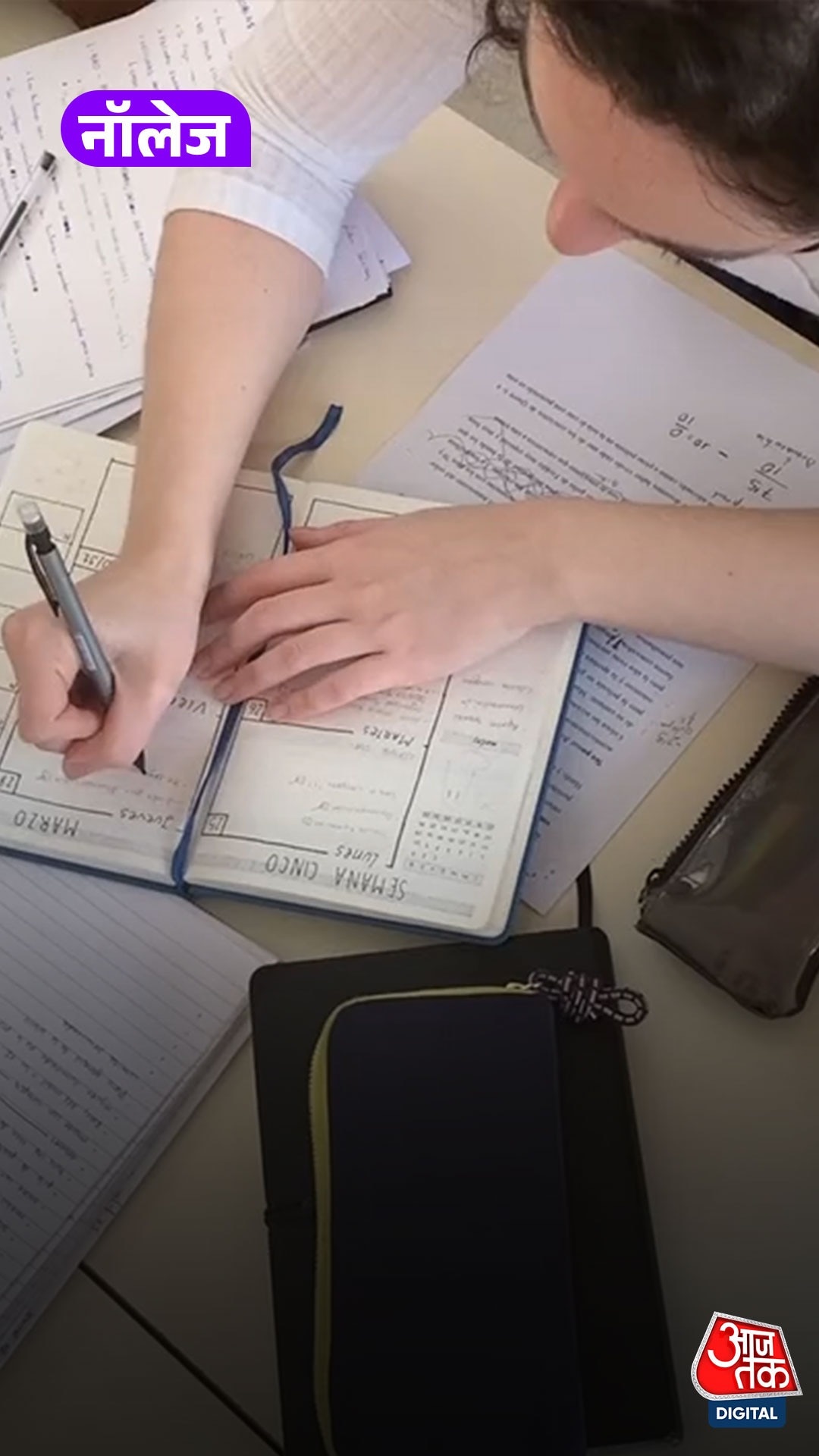 Student writing in a copy