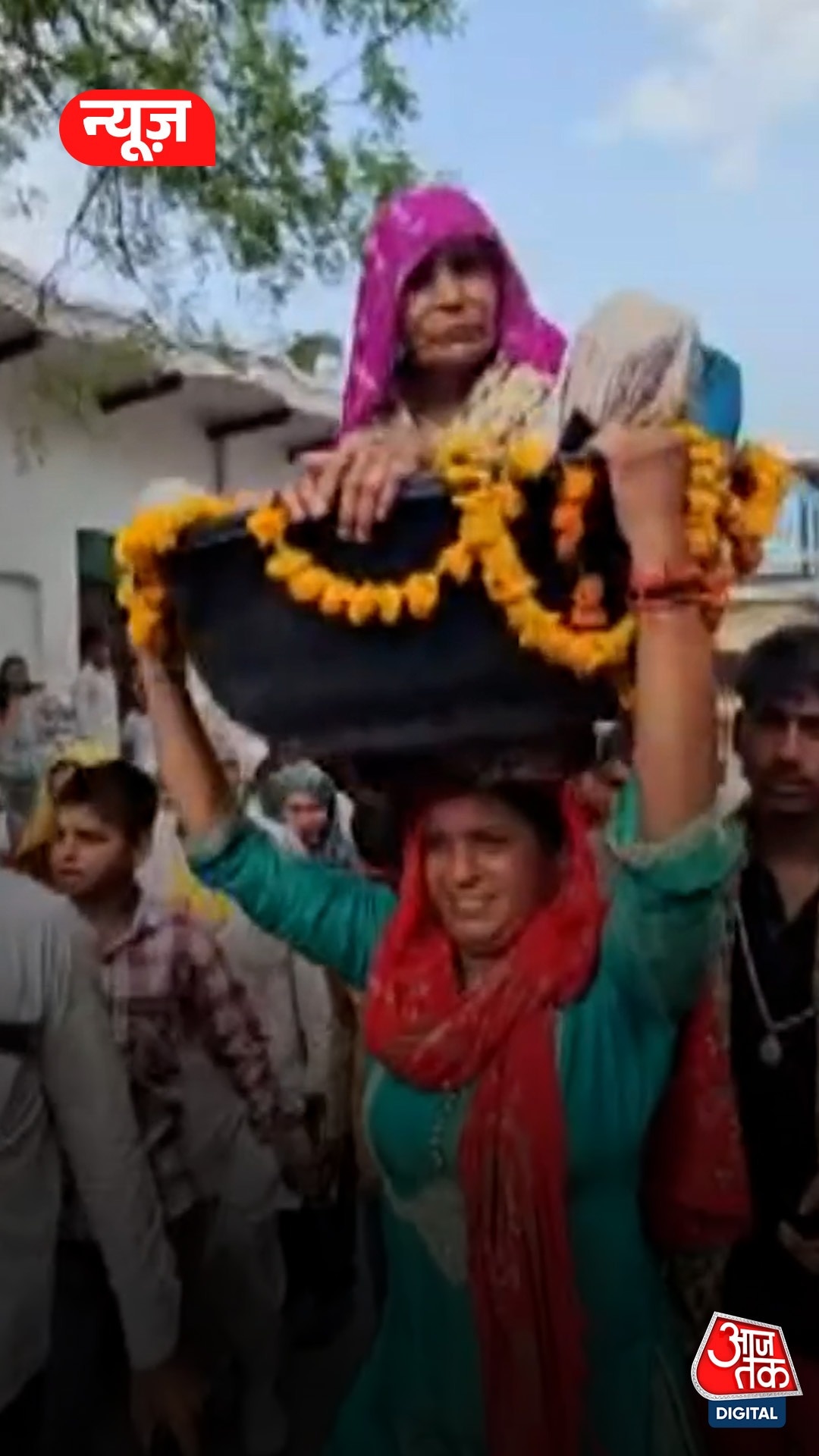 Woman carries elderly mother in law