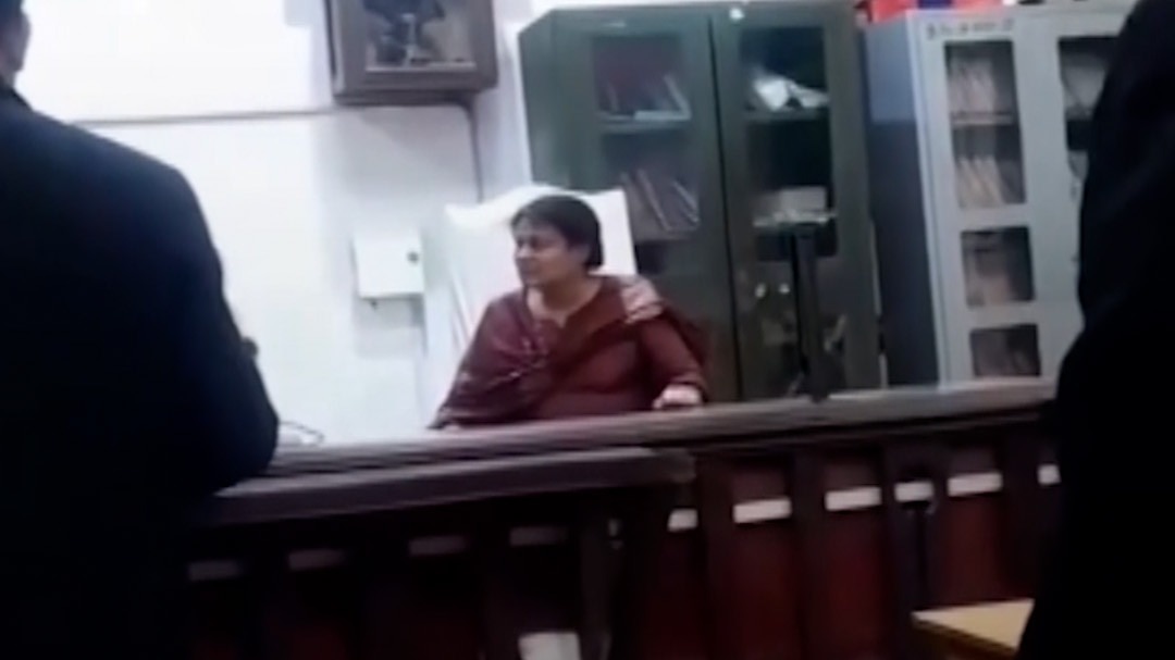 Woman sits on judge chair