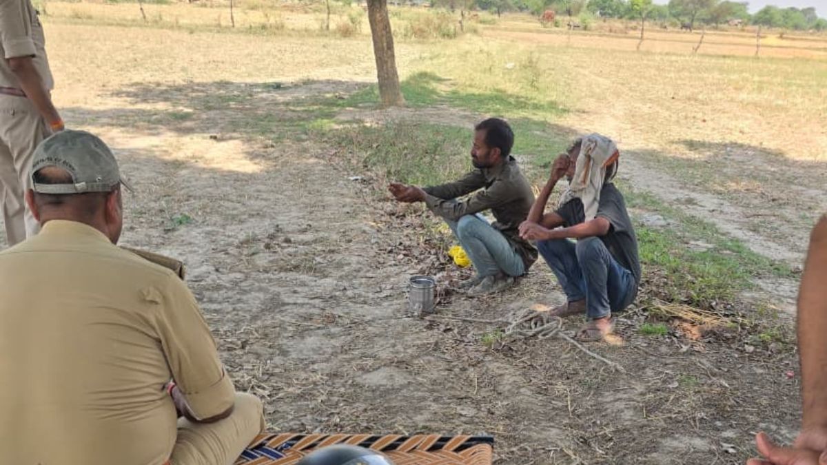 banda youth climbs high voltage tower demand 25 lakh loan police rescue