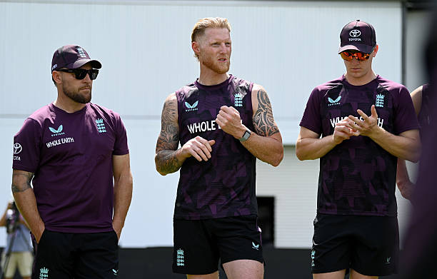  England captain Ben Stokes speaks to the team alongside coach Brendon McCullum and Harry Brook.