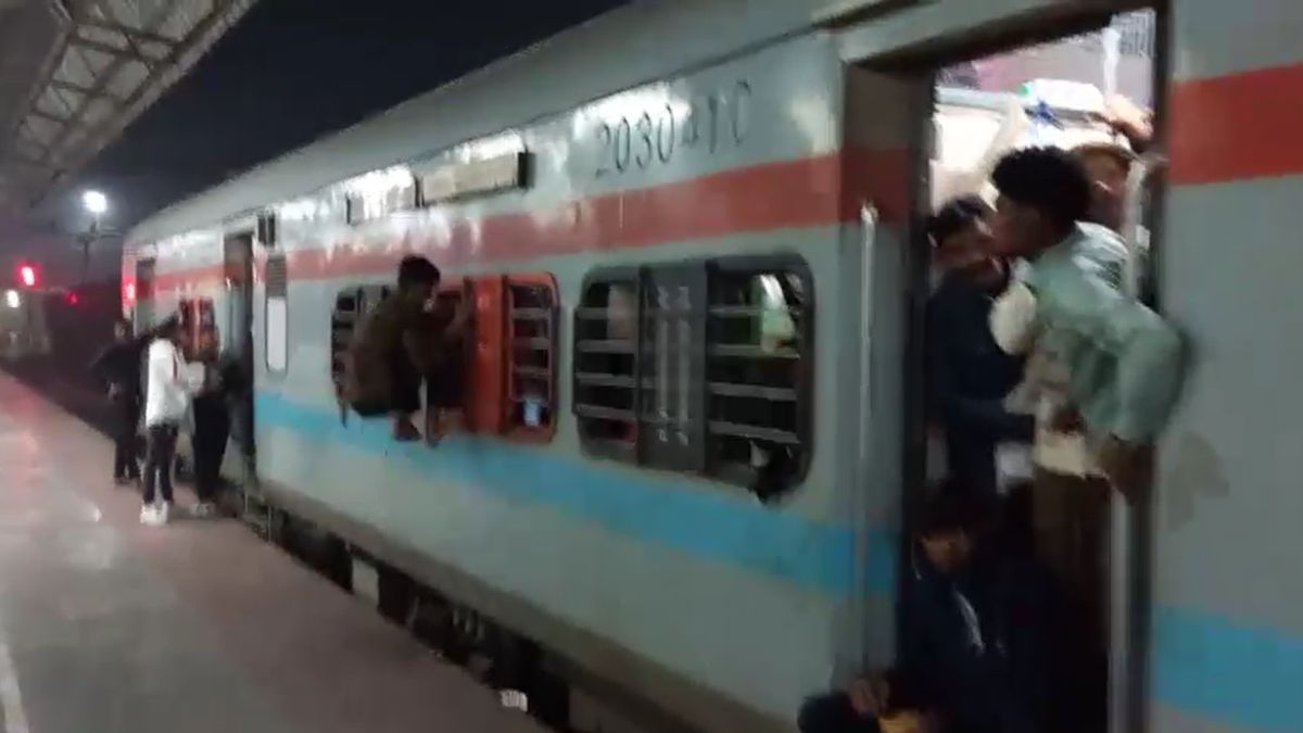 Gates windows bathrooms Delhi train overcrowded packed brim