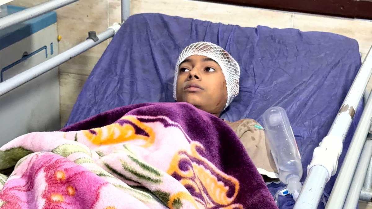 Injured child receiving medical treatment at a hospital following the Kuhestak strike.