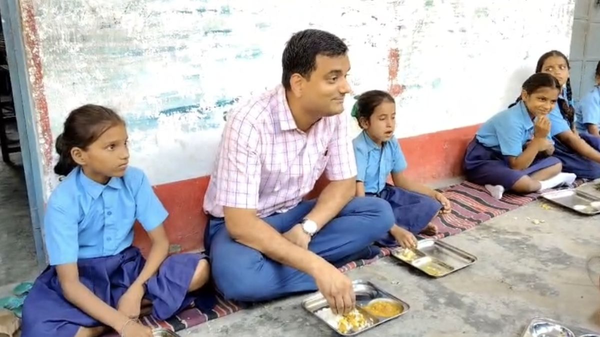 Katihar DM Sits With Students Teaches Promotes Self Reliance Midday meal Washing Own Plate