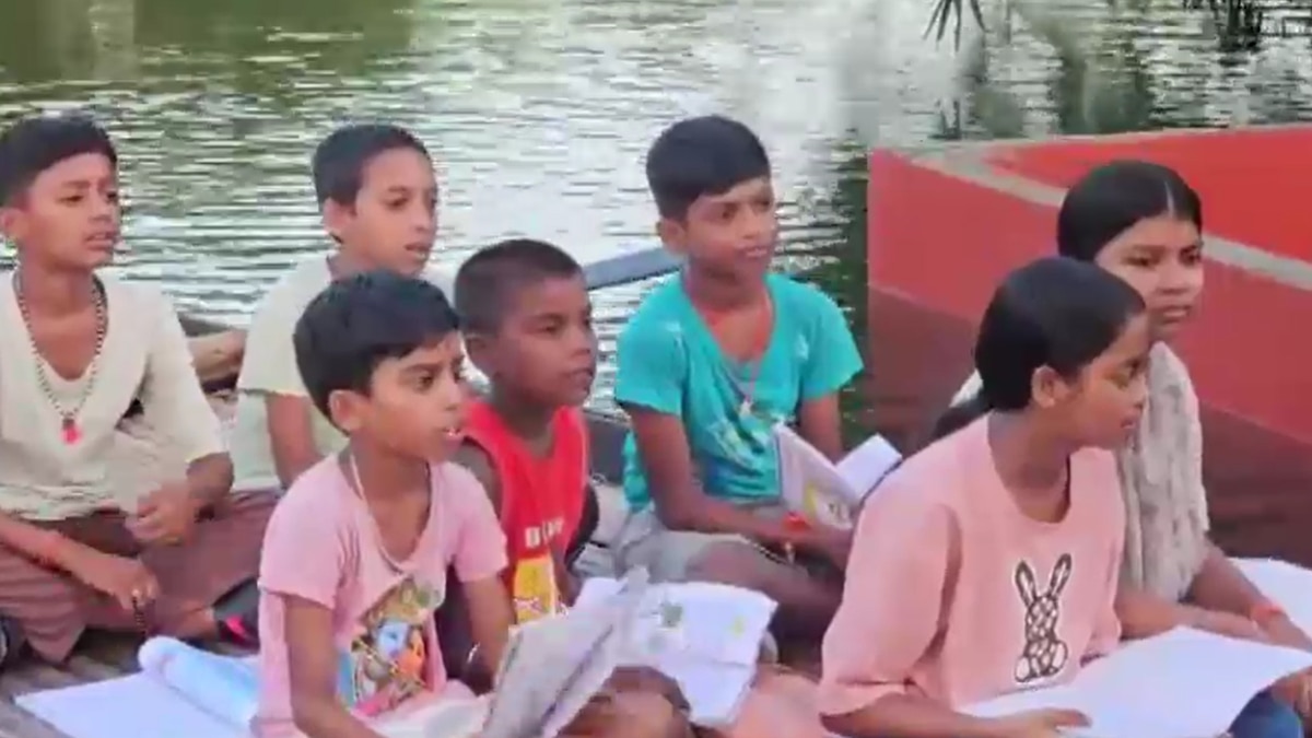 Students study with books on a boat