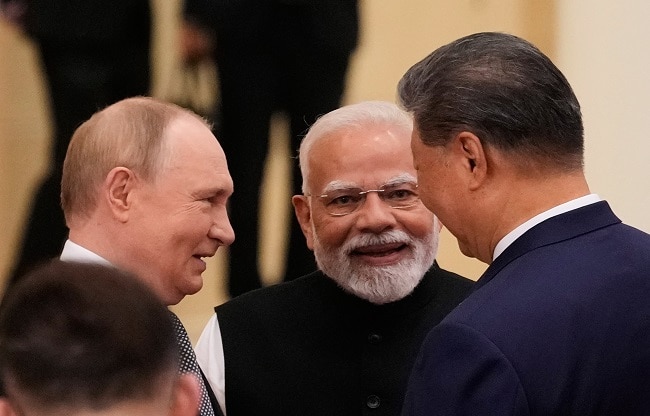 vladimir putin with narendra modi and xi jinping (Photo- PTI) vladimir putin with narendra modi and xi jinping (Photo- PTI)