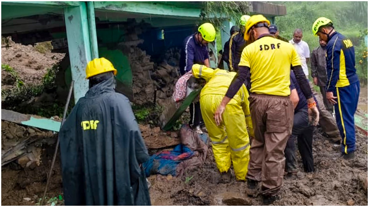 SDRF personnel conduct a rescue operation after debris swept into a house following rainfall, at Udyuda village, in Almora SDRF personnel conduct a rescue operation after debris swept into a house following rainfall, at Udyuda village, in Almora