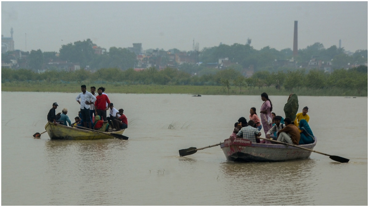 Villagers, including school children, use rowboats to navigate through flooded agricultural fields and commute after water from the overflowing Ganges River submerged low-lying areas, in Kanpur Villagers, including school children, use rowboats to navigate through flooded agricultural fields and commute after water from the overflowing Ganges River submerged low-lying areas, in Kanpur