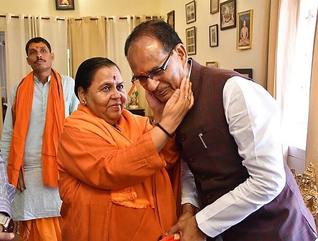उमा भारती और मध्य प्रदेश के मुख्यमंत्री शिवराज सिंह चौहान (फाइल फोटोः पीटीआई)