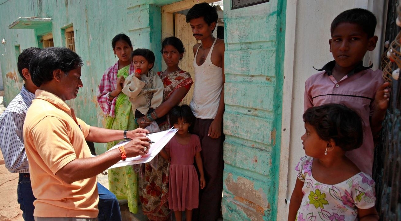 census officer collects details of a family 