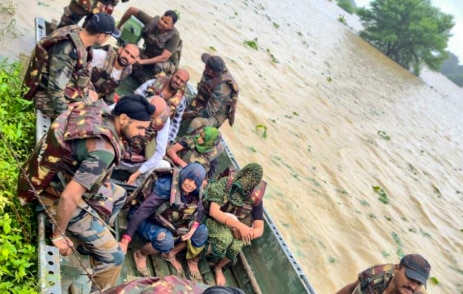 Army personnel rescue people from a flood-affected area, in Shivpuri district, Madhya Pradesh (PTI Photo)
