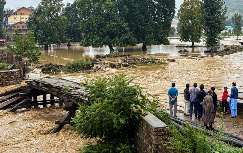 Partially damaged bridge as the Jhelum river flows in spate in Anantnag, Jammu and Kashmir (PTI Photo)