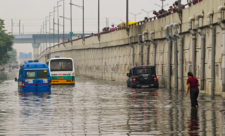 Vehicles stuck on a waterlogged road after heavy rainfall, at Vinod Nagar area, in New Delhi, Friday, Aug. 29, 2025. (PTI Photo)