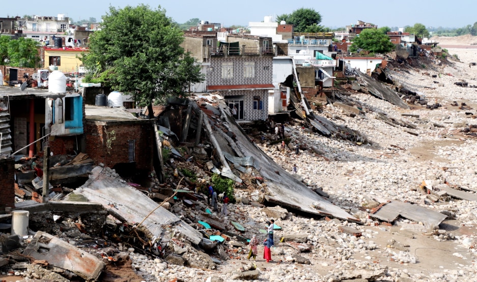 An aerial view of vehicles parked in mud at a flood-affected near the Tawi river after heavy rainfall, at Peer Kho, in Jammu, Sunday, Aug. 31, 2025. (PTI Photo) 