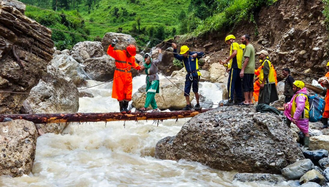 NDRF and SDRF personnel with others during a search and rescue operation at a disaster-hit village, in Bageshwar district, Uttarakhand. (@DIPR_UK/X via PTI Photo) 