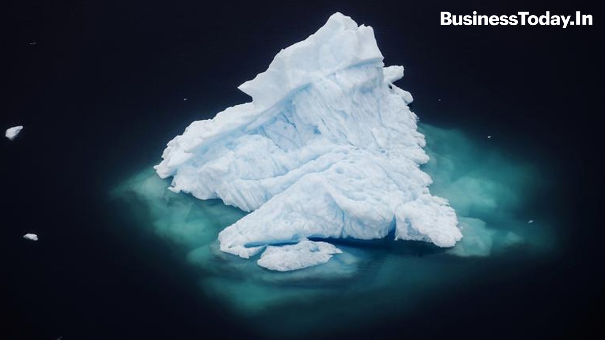 An iceberg floats in a fjord near the town of Tasiilaq, Greenland.