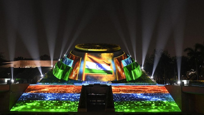 The building is made on a land area of about 10,491 sq mt. The logo of the building represents the hands of the people of India holding the Chakra symbolising the nation and democracy. The building is made on a land area of about 10,491 sq mt. The logo of the building represents the hands of the people of India holding the Chakra symbolising the nation and democracy.