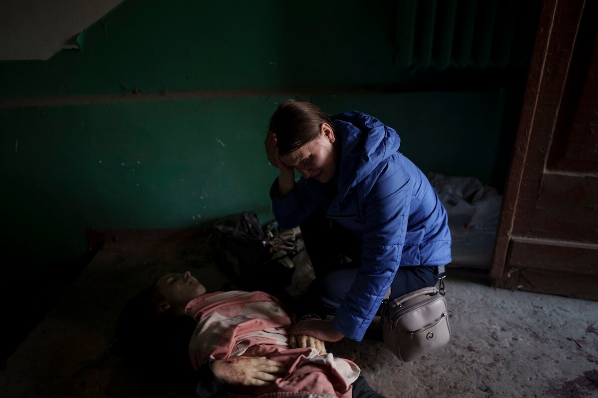 Nina Shevchenko mourns over the body of her 15-year-old son Artem Shevchenko, who was killed in a Russian attack on Kharkiv, Ukraine.