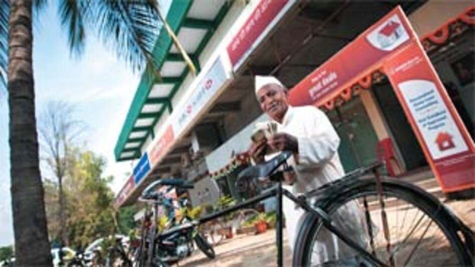 Soya bean farmer Murlidhar Karanjkar at his bank in Deolali Camp, Maharashtra Soya bean farmer Murlidhar Karanjkar at his bank in Deolali Camp, Maharashtra
