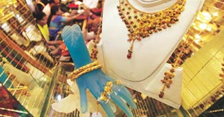 Gold, silver fall on global cues 