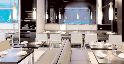 The large fish tanks lend an eerie glow to Yauatcha's minimalistic interiors