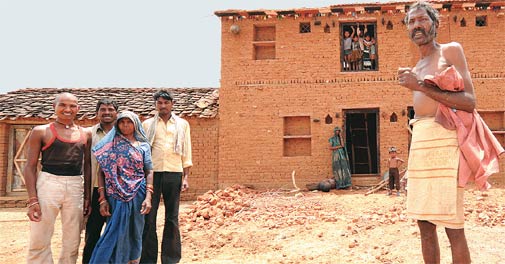 Bare Existence: Oodhal Prasad Khushwaha (right) a farmer from Madola block in Lalitpur district, UP