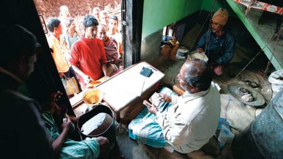 Villagers buying food items at a ration shop in Birbhum district of West Bengal. The National Food Security Bill gives people the right to get foodgrains at subsidised prices. Photo: Shekhar Ghosh/www.indiatodayimages.com Villagers buying food items at a ration shop in Birbhum district of West Bengal. The National Food Security Bill gives people the right to get foodgrains at subsidised prices. Photo: Shekhar Ghosh/www.indiatodayimages.com