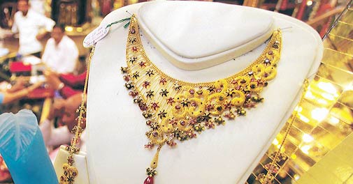 Gold down by Rs 235 to hit 6-month low on demand