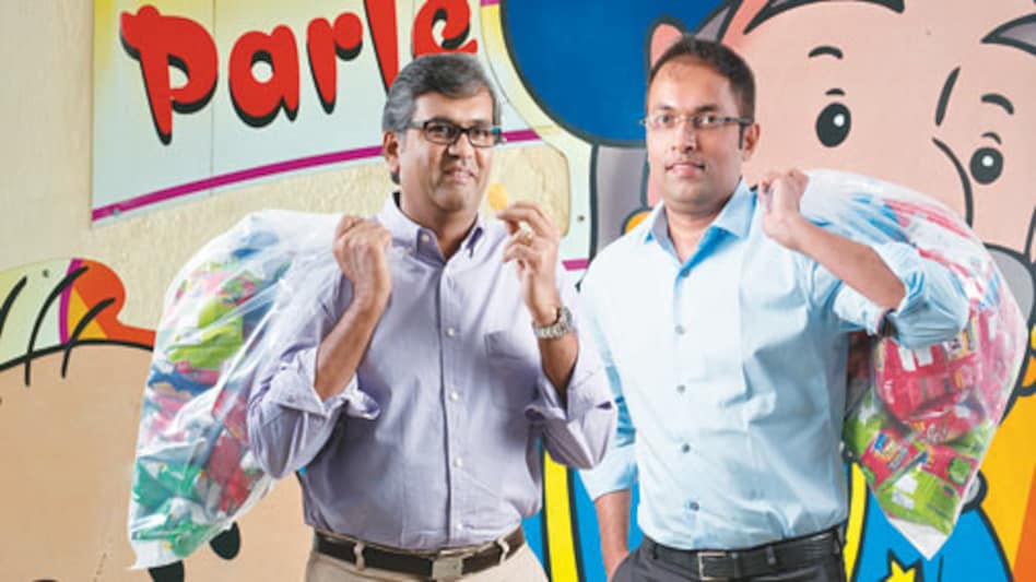 The third generation of the Chauhan family, Ajay (left) and Arup, with a bagful of snacks and biscuits each. <em>Photo: Rachit Goswami</em> The third generation of the Chauhan family, Ajay (left) and Arup, with a bagful of snacks and biscuits each. <em>Photo: Rachit Goswami</em>