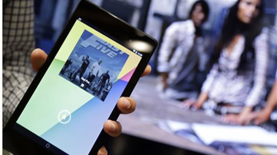 The new Nexus 7 tablet works in conjuction with the Chromecast device to control a television during a Google event on July 24, 2013, in San Francisco. (Photo: AP) The new Nexus 7 tablet works in conjuction with the Chromecast device to control a television during a Google event on July 24, 2013, in San Francisco. (Photo: AP)