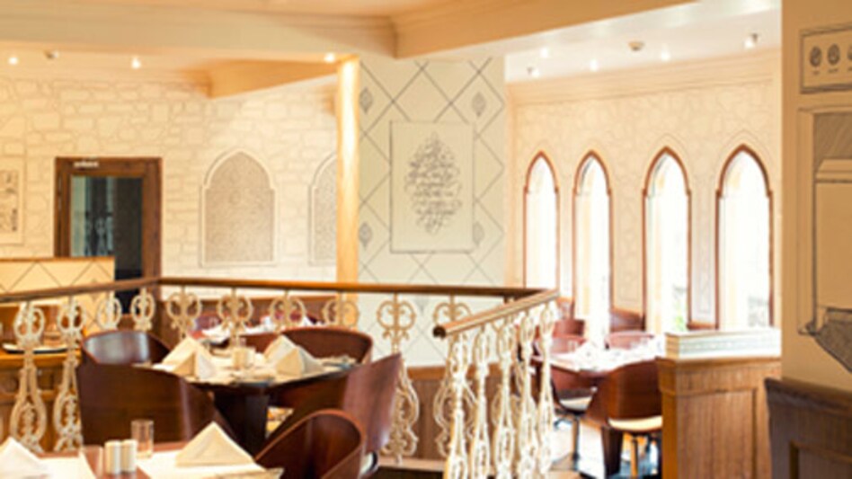 The walls of the Smoke House Deli, Hauz Khas, are bathed in white and adorned with sketches of the Khilji royalty. The walls of the Smoke House Deli, Hauz Khas, are bathed in white and adorned with sketches of the Khilji royalty.