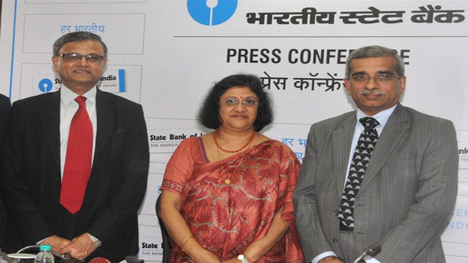 Newly appointed SBI Chairperson Arundhati Bhattacharya (in centre) flanked by Hemant Contractor, Group Executive of International Banking and A Krishna Kumar, Managing Director of State Bank of India during a press conference in Mumbai on Tuesday, Oct 9, Newly appointed SBI Chairperson Arundhati Bhattacharya (in centre) flanked by Hemant Contractor, Group Executive of International Banking and A Krishna Kumar, Managing Director of State Bank of India during a press conference in Mumbai on Tuesday, Oct 9,