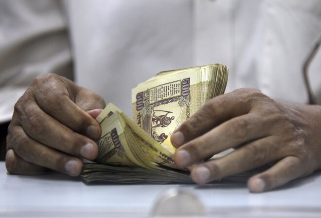 Rupee closes higher on likely RBI intervention 
