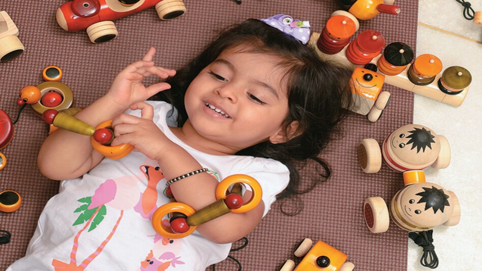 A child with toys made in Channapatna, Karnataka <em>Photo: Nilotpal Baruah</em> A child with toys made in Channapatna, Karnataka <em>Photo: Nilotpal Baruah</em>