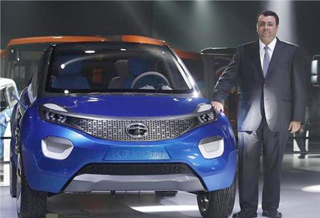 Tata Group Chairman Cyrus Mistry poses with Tata's Nexon concept car during the Auto Expo February 5, 2014. <em>Photo: Adnan Abidi/Reuters</em>