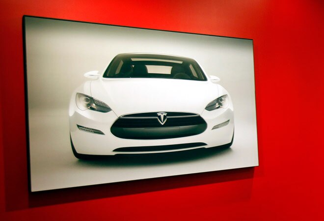 Tesla Motors CEO confirms Apple talks, says deal 'unlikely' Tesla Motors CEO confirms Apple talks, says deal 'unlikely'