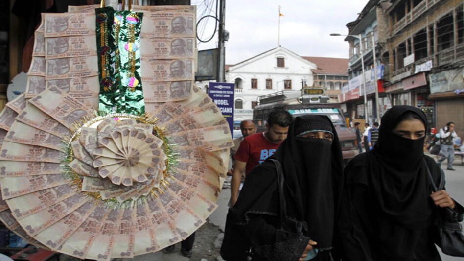 Rupee surges to 10-month high, ends almost flat Rupee surges to 10-month high, ends almost flat