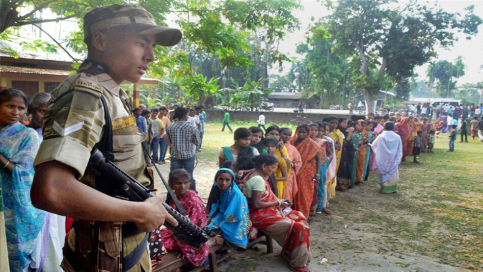 A security guard at a polling centre at Koliabar in Nagaon district of Assam. Photo: PTI A security guard at a polling centre at Koliabar in Nagaon district of Assam. Photo: PTI