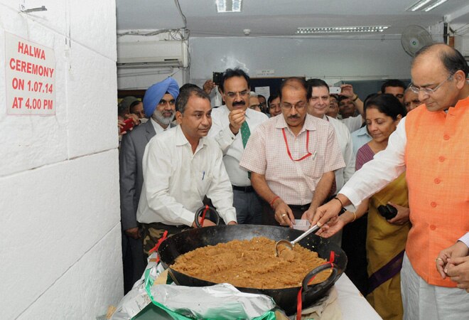FM Arun Jaitley during the Halwa Ceremony marking the beginning of printing of Budgetary documents, in New Delhi on Tuesday. Also seen Minister of State for Commerce & Industry Nirmala Sitharaman. Photo: PTI 
