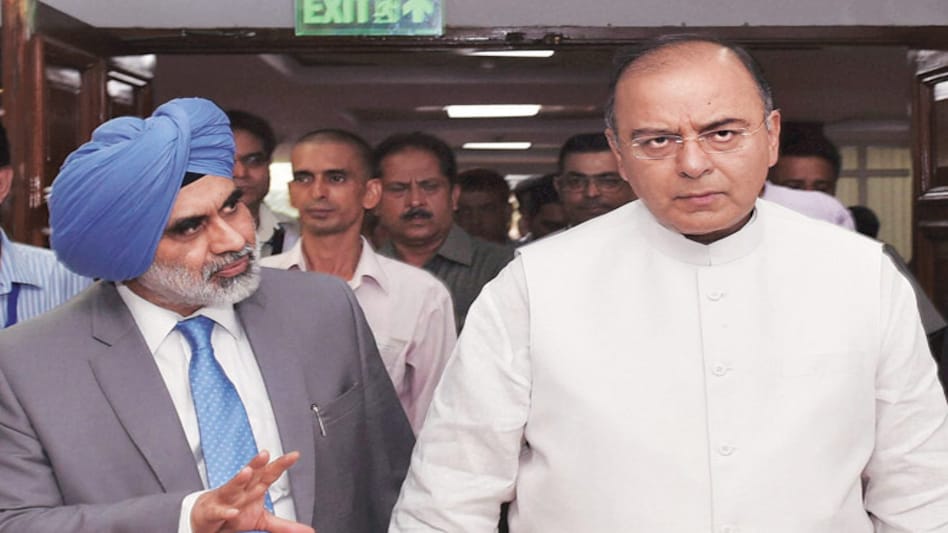 Finance Minister Arun jaitley with Financial Services Secretary GS Sandhu Finance Minister Arun jaitley with Financial Services Secretary GS Sandhu