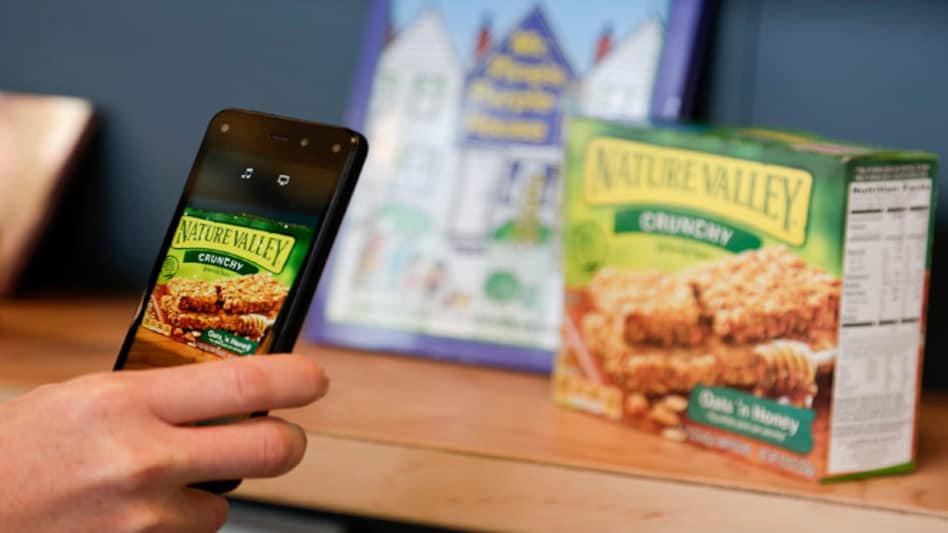 An Amazon representative shows off the Firefly scanning feature on the company's new Fire smartphone in Seattle (Photo: Reuters) An Amazon representative shows off the Firefly scanning feature on the company's new Fire smartphone in Seattle (Photo: Reuters)