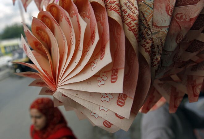 Rupee snaps two-day rally to end at 60.39 against US dollar