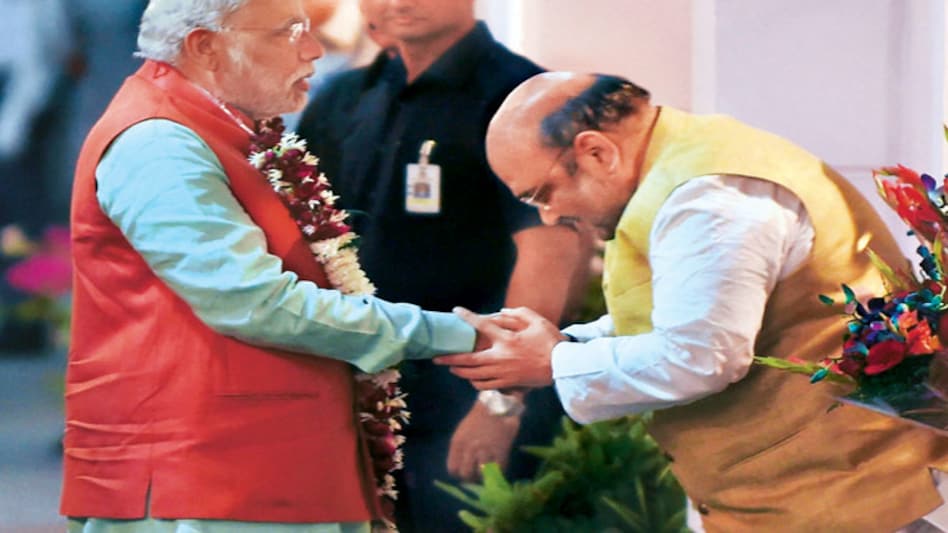 Prime Minister Narendra Modi is felicitated by BJP president Amit Shah in New Delhi on Oct 19, 2014 Prime Minister Narendra Modi is felicitated by BJP president Amit Shah in New Delhi on Oct 19, 2014