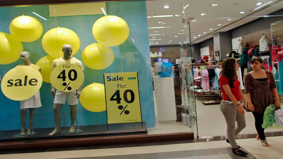 Shoppers leave a retail store inside a shopping mall in Mumbai. (Photo: Reuters) Shoppers leave a retail store inside a shopping mall in Mumbai. (Photo: Reuters)