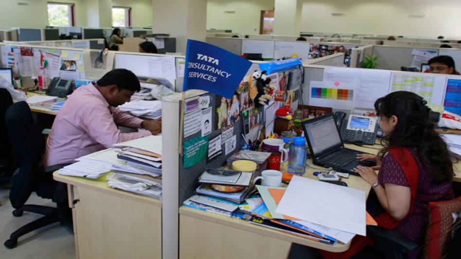 Employees of Tata Consultancy Services (TCS) work inside the company headquarters in Mumbai. (Source: Reuters) Employees of Tata Consultancy Services (TCS) work inside the company headquarters in Mumbai. (Source: Reuters)