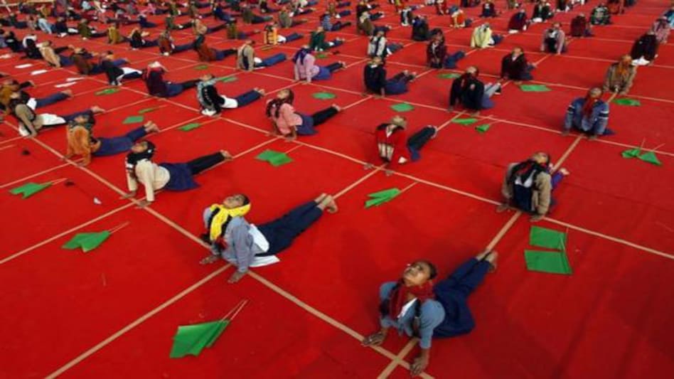 School girls attend a yoga session during a camp in Ahmedabad on January 11, 2014. Photo: Reuters School girls attend a yoga session during a camp in Ahmedabad on January 11, 2014. Photo: Reuters