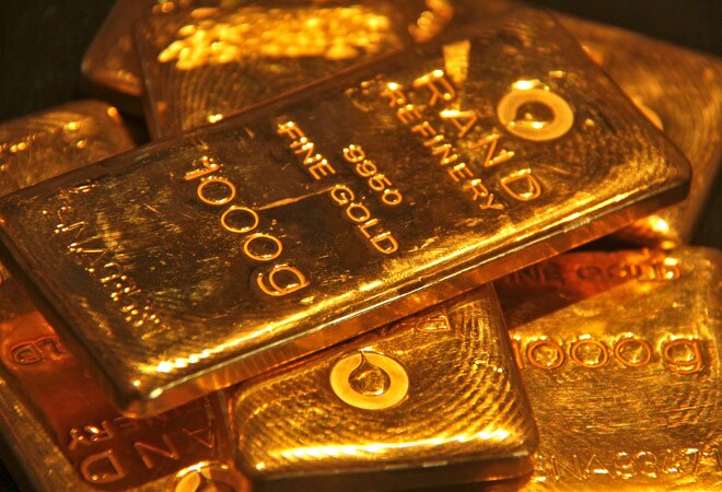Gold prices fall in futures trade amid weak global cues