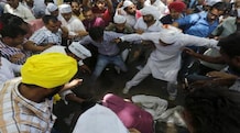 A 41-yr-old farmer from Rajasthan commits suicide at AAP rally Protesters gather around a farmer who hung himself from a tree during a rally organized by AAP, in New Delhi April 22, 2015. (Photo: Reuters)