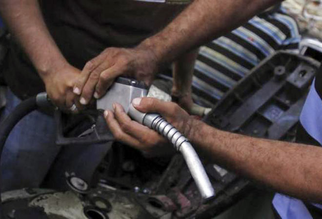 People jostle for a pump nozzle at a petrol station during a fuel shortage in Cairo June 26, 2013. (Photo: Reuters)